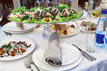 Grilled salmon in a dish on the dinner table