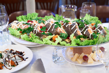 Grilled salmon in a dish on the dinner table