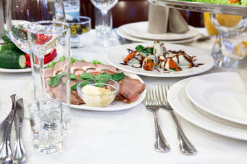 Russian rolled pancakes with red caviar in a plate on the table