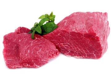 Cut of  beef steak with green leaf. Isolated.