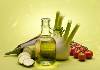 vegetable with olive oil on green background