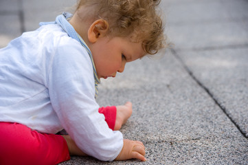 baby is looking at the floor