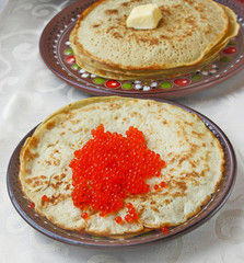 Pancake with red caviar