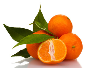 Ripe tasty tangerines with leaves and segments isolated on white