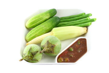 Chili shrimp paste and steam vegetable on white background.