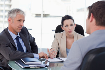 Business team negotiating with a customer