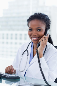 Portrait Of A Female Doctor On The Phone