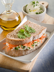 healthy sandwich with carrot cheese and parsley