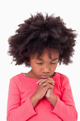 Fototapeta na wymiar Portrait of a girl praying