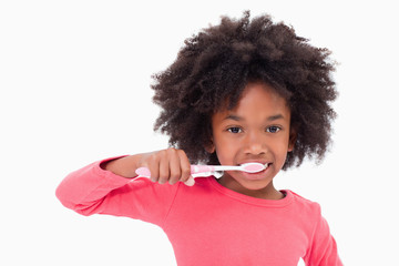 Girl brushing her teeth