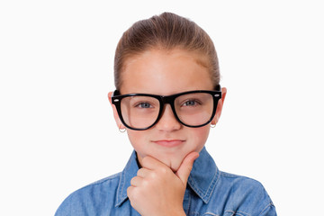 Girl thinking with her hand on her chin