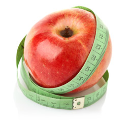 apple with measuring tape isolated on white background
