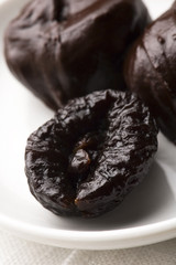 Dried plums in chocolate
