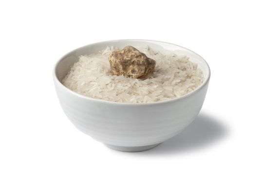 Cup of raw rice with white truffle