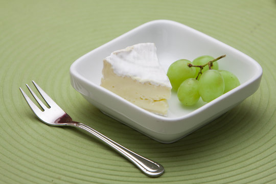 Dessert with cheese and grapes