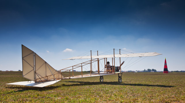 Replica of an old airplane from 1910 taking off