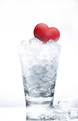 heart inside ice cubes in the glass