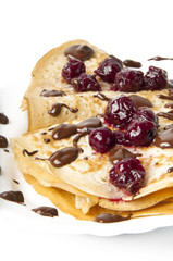 pancakes with cherry jam and chocolate icing