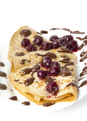 pancakes with cherry jam and chocolate icing