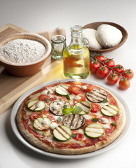 still life with pizza and ingredients