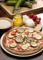 still life with pizza and ingredients