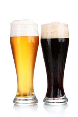 black and golden beer in glasses isolated on white