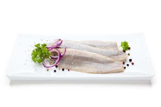 Marinated herring fillets with vegetables