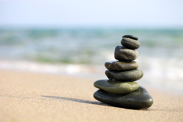 Fototapeta na wymiar Stack of sea pebbles on the beach