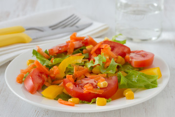 vegetable salad with glass of water