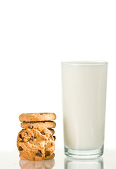 Chocolate chips cookies and milk on white background
