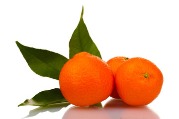 Ripe tasty tangerines with leaves isolated on white