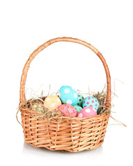 Colorful Easter eggs in the basket  isolated on white