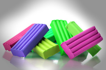 Children bright plasticine isolated on white