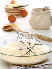 Vanilny sauce in a bowl and whisk for whipping.
