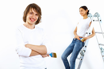 Obraz premium Young couple with paint brushes together