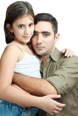 Obraz premium Latin father hugging his daughter isolated on white
