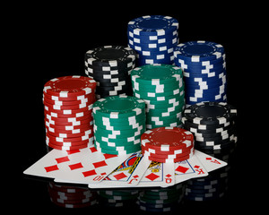 stacks of poker chips with royal flush