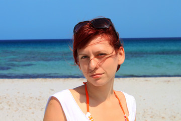 Happy young woman at the beach, Italy, Sardegna