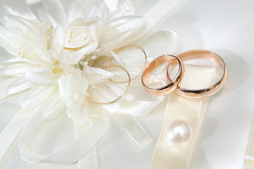 Wedding gold rings on a pillow