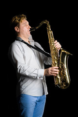 Fototapeta na wymiar Musician with a saxophone