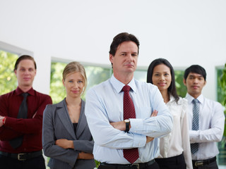 portrait businesspeople smiling and looking at camera