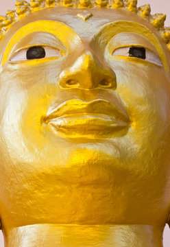 Face golden Buddha as contemporary art.