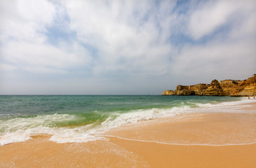 Idyllic wild beach in summertime. Algarve, Portugal.