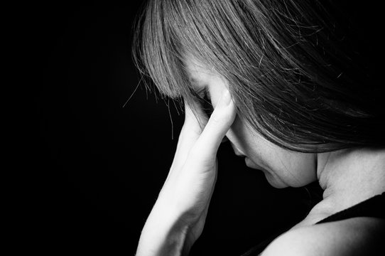 Closeup portrait of depressed teenager girl.