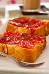 Foto op Plexiglas slice of bread with red jam © wacharaphong