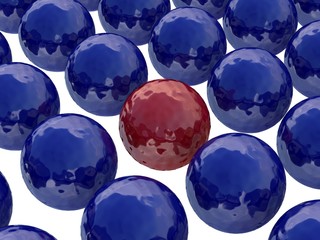 Red ball among dark blue balls