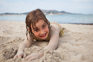 little girl on sandy beach