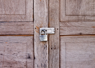 padlock on the old wooden wall