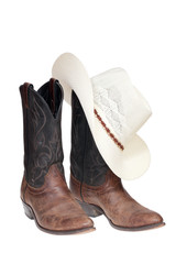 Cowboy boots and hat isolated over white with clipping path