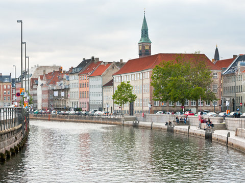 Frederiksholms Kanal and view on Town Hall tower in Copenhagen